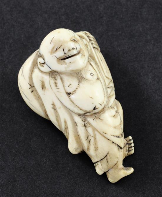 A Japanese ivory netsuke of Hotei, 18th / 19th century, 5.5cm, age cracks